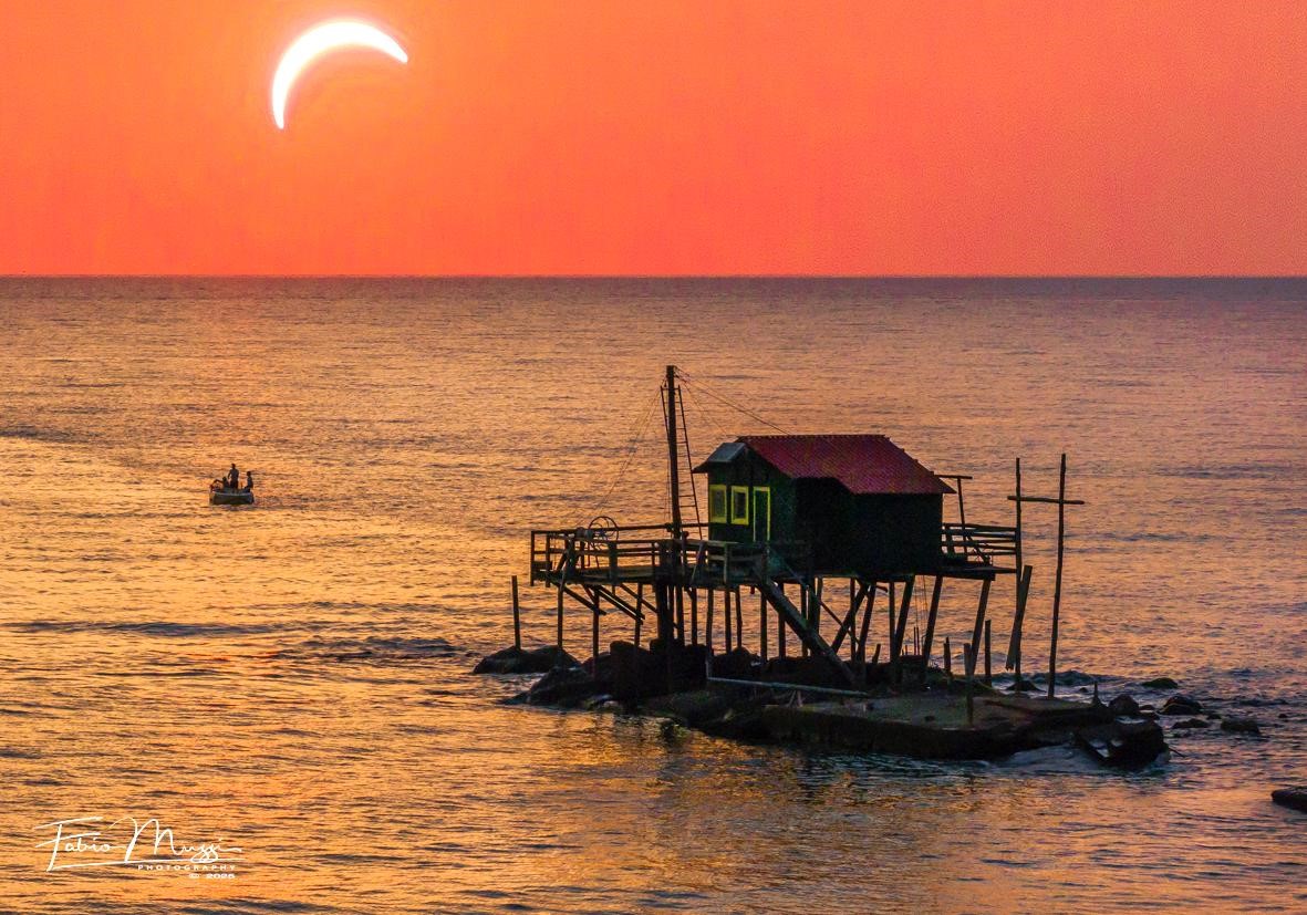 Eclissi di sole in bocca d'Arno foto Muzzi